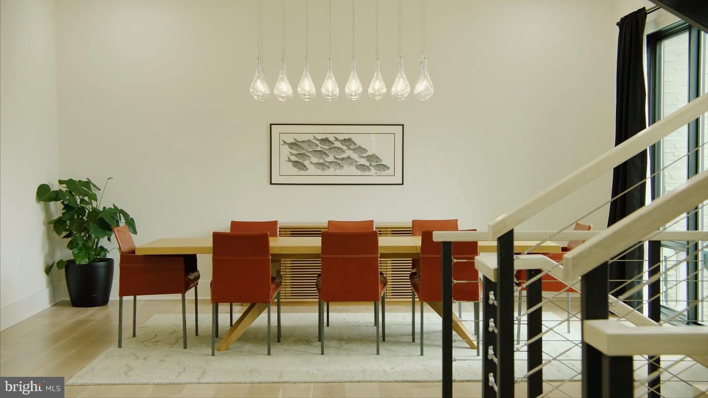 8100 Lewinsville Road McLean, VA 22102 - Photo 4 of 49 a view of a livingroom with furniture and a potted plant