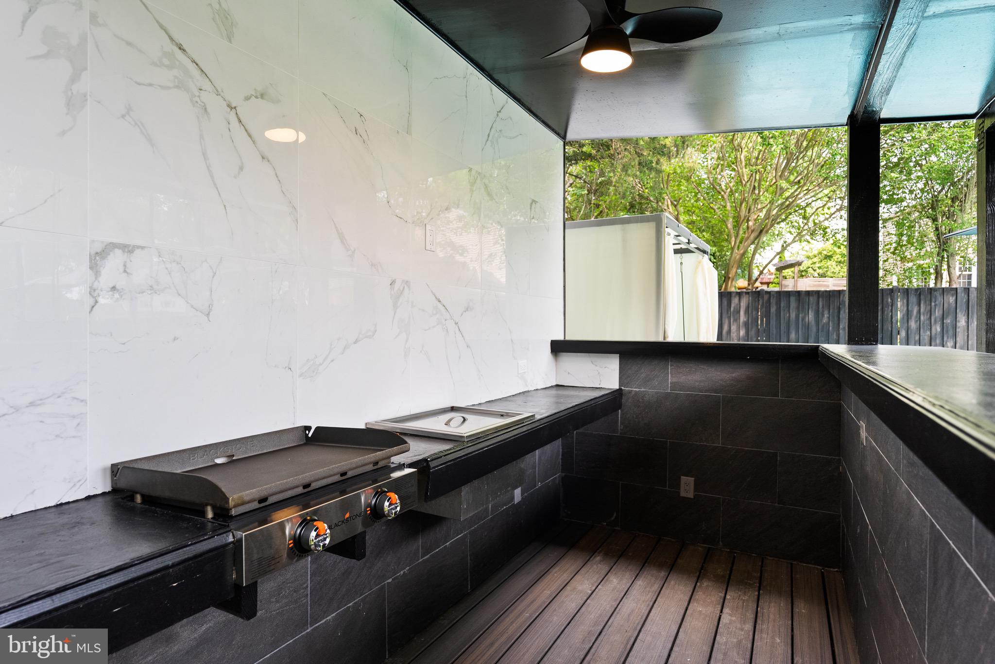 8100 Lewinsville Road McLean, VA 22102 - Photo 46 of 49 a kitchen with a stove and a wooden floor