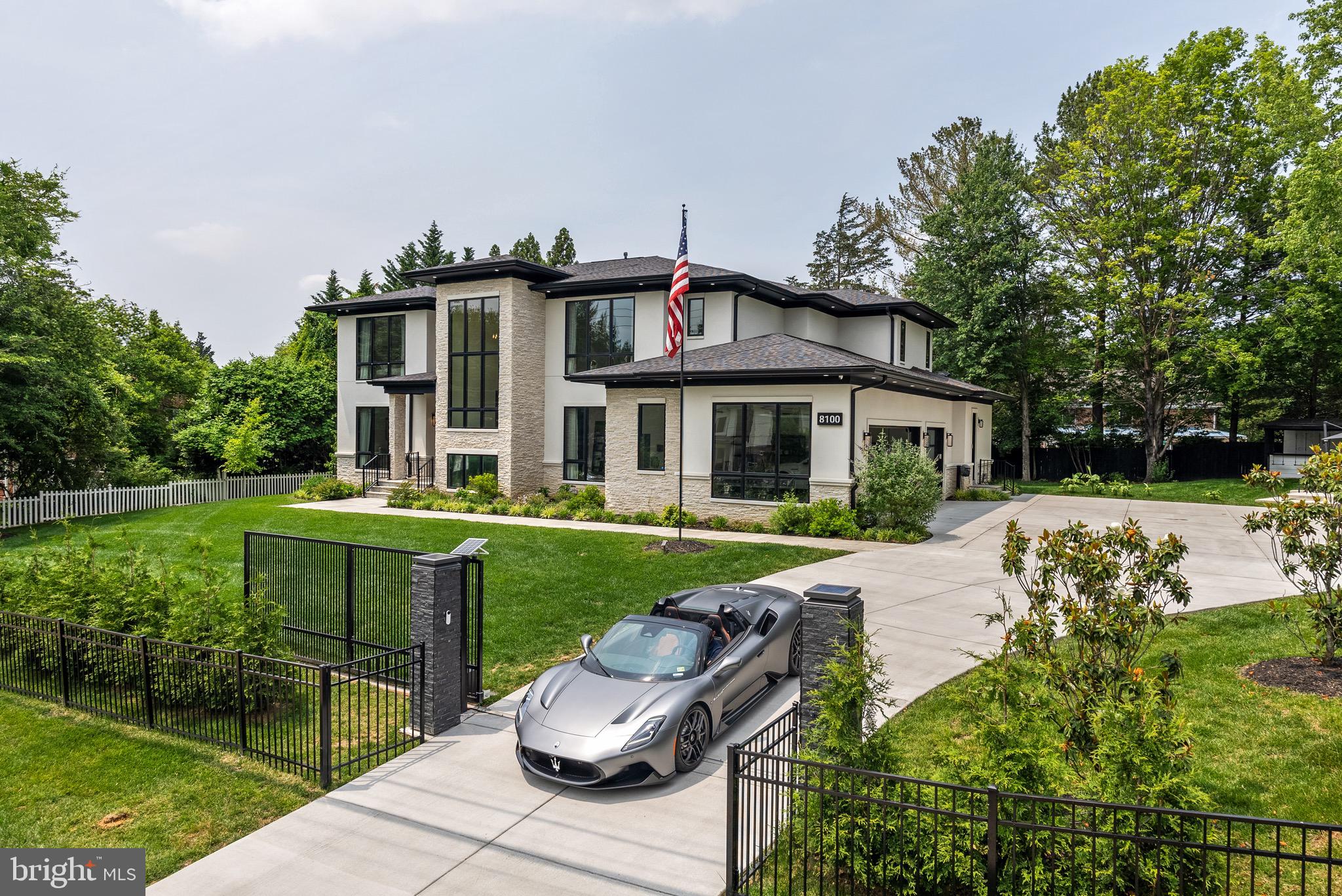 8100 Lewinsville Road McLean, VA 22102 - Photo 49 of 49 a front view of a house with a yard table and chairs