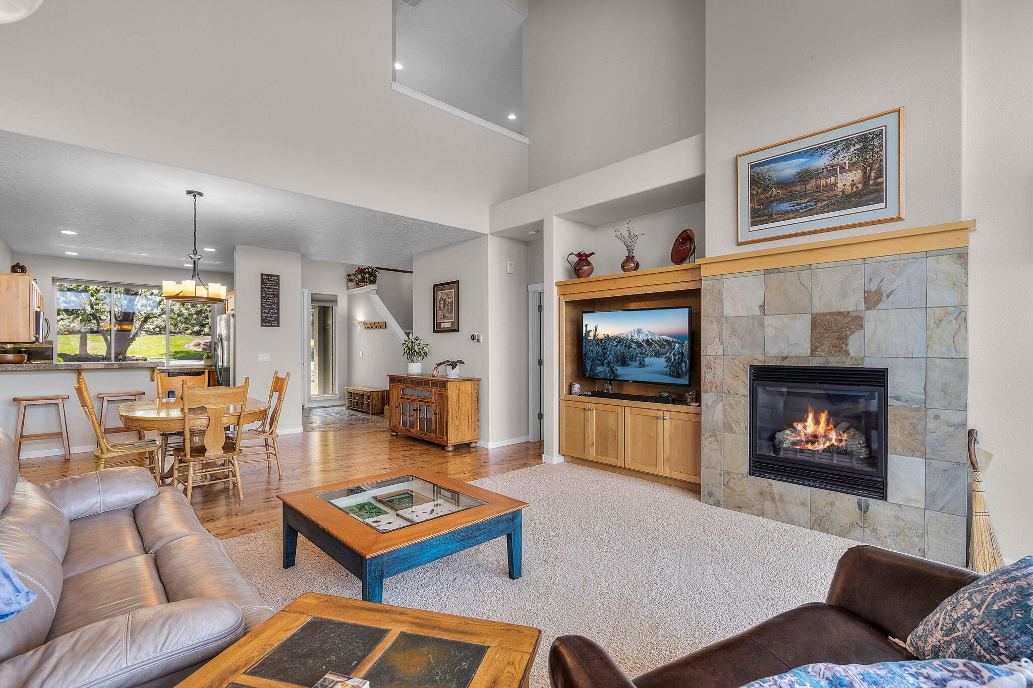10870 Village Loop Redmond, OR 97756 - Photo 7 of 35 a living room with furniture a flat screen tv and a fireplace