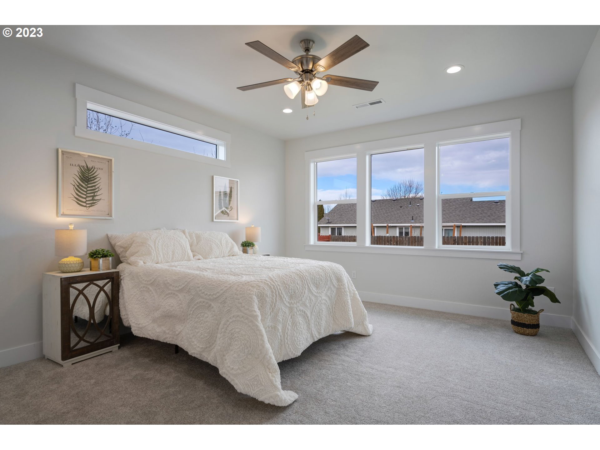 318 Sage Street Boardman, OR 97818 - Photo 12 of 20 a living room with a bed furniture and a large window