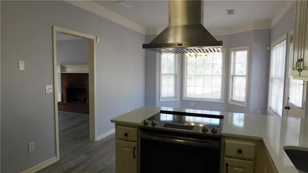 a kitchen with a sink and cabinets