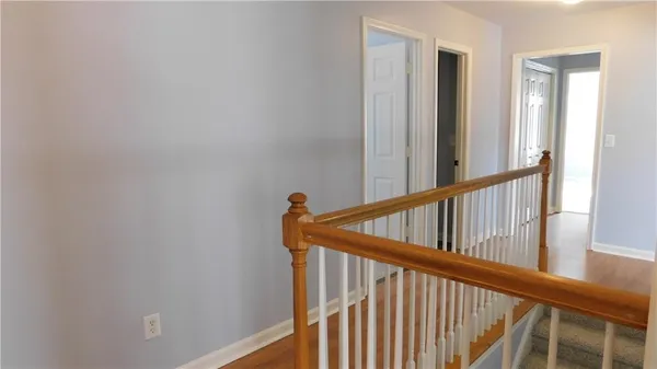 a view of staircase with rug