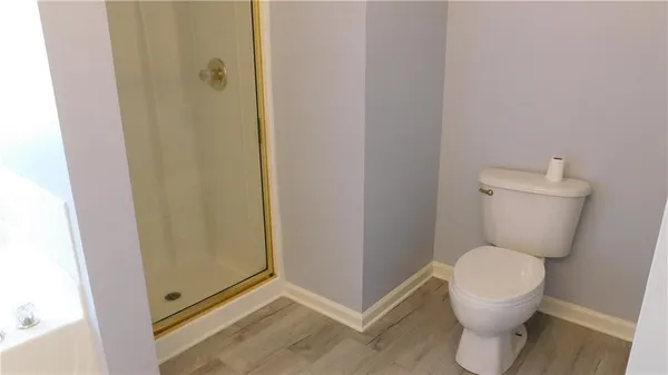 a white toilet sitting next to a bathroom sink