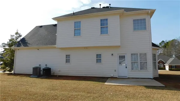 a front view of a house with a garage