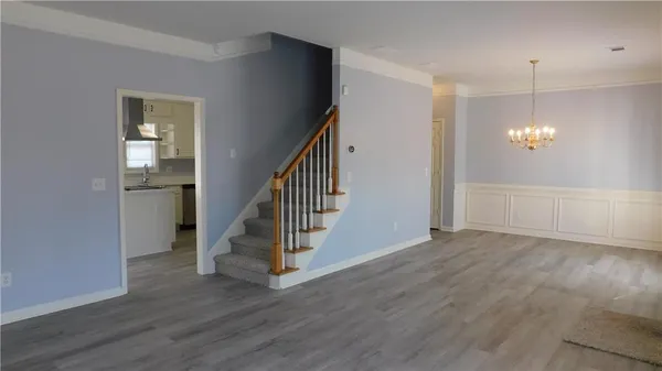 an entryway in a hall with an entryway and wooden floor