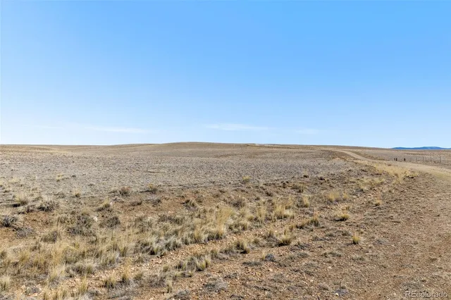 a view of an ocean beach and mountain