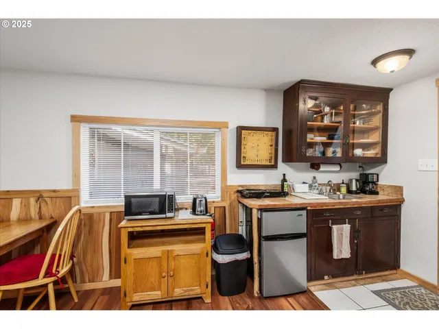 a kitchen with a stove a sink and a refrigerator