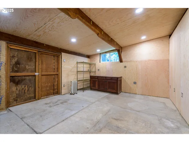 a view of an empty room with a cabinet