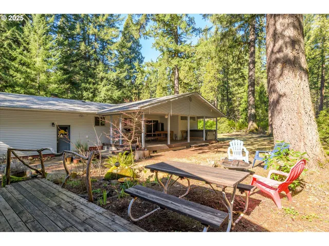 a view of a house with a tree in the background