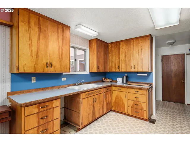 a backyard of a house with yard and outdoor seating