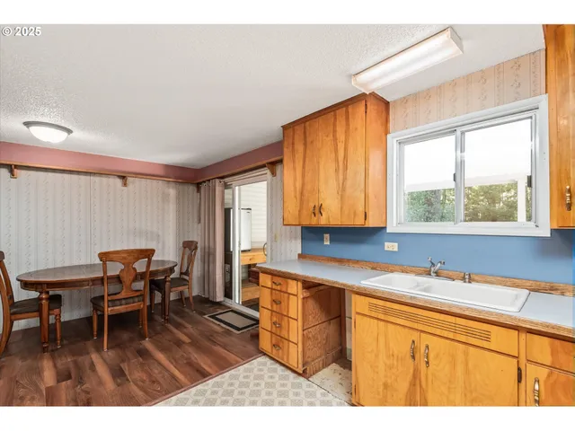a living room with furniture a fireplace and book shelf