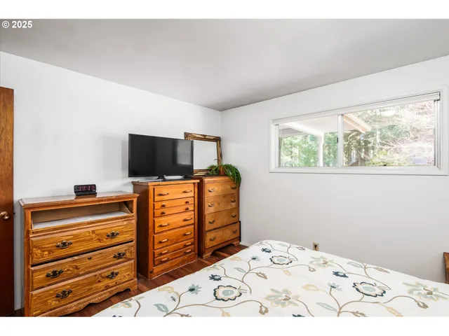 a kitchen with a chair a dining table and chairs