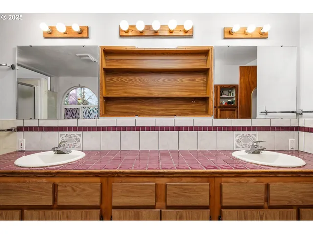 a kitchen with stainless steel appliances granite countertop a sink and a cabinets