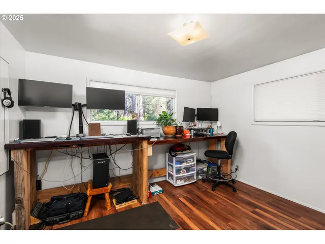 a workspace with furniture and a flat screen tv