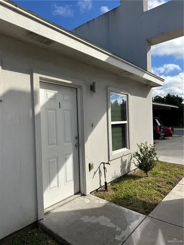 a kitchen with stainless steel appliances kitchen island granite countertop a refrigerator a sink dishwasher a stove top oven a counter space and cabinets