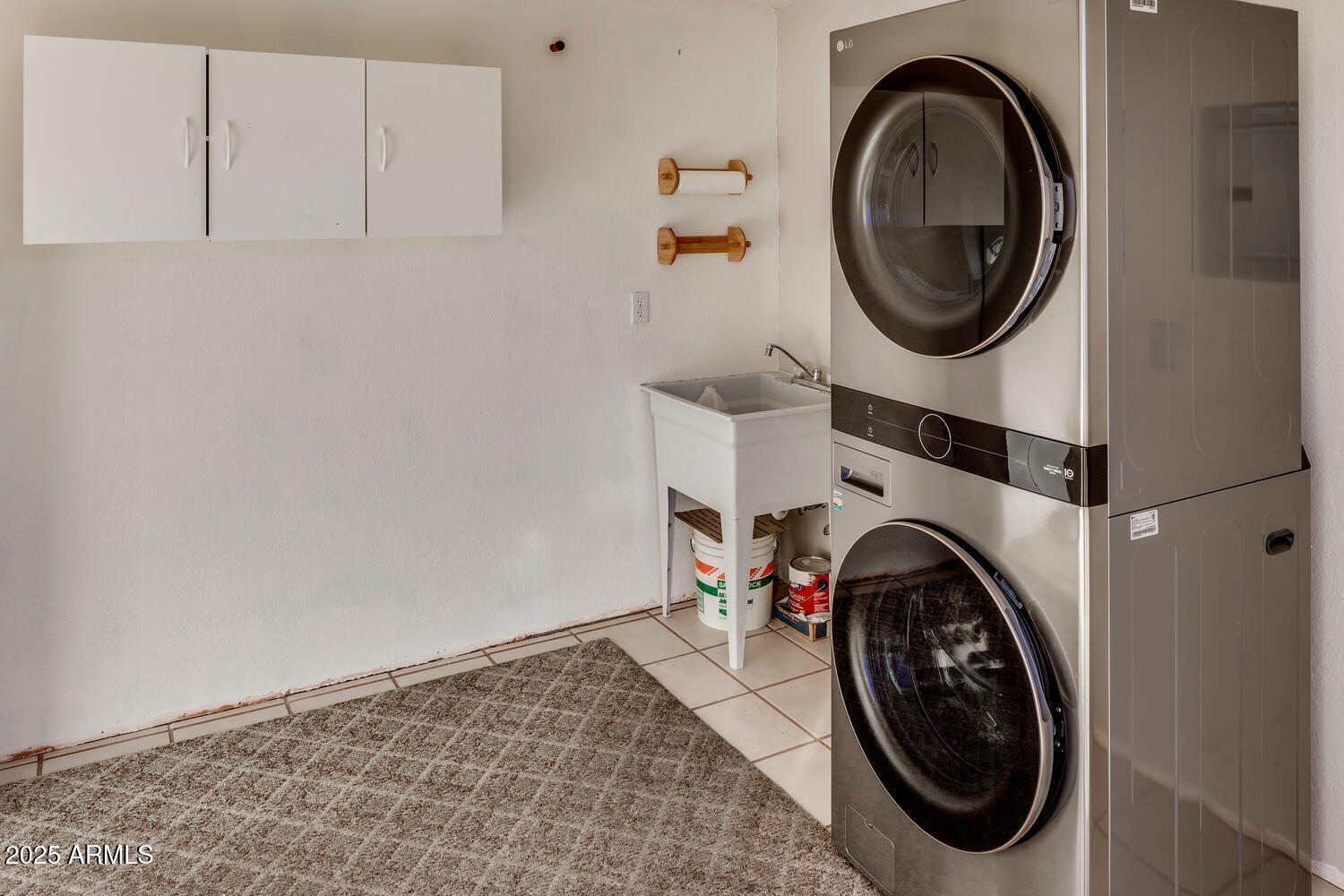 17200 West Bell Road, Unit 1500 Surprise, AZ 85374 - Photo 5 of 9 a view of a storage and utility room with washer and dryer