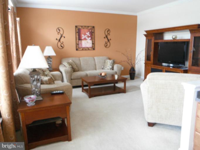 5622 New Forge Road White Marsh, MD 21162 - Photo 21 of 29 a living room with furniture and a flat screen tv