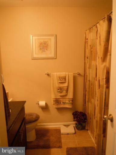 5622 New Forge Road White Marsh, MD 21162 - Photo 23 of 29 a bathroom with a toilet a sink and shower