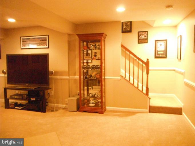 5622 New Forge Road White Marsh, MD 21162 - Photo 24 of 29 a view of a livingroom with furniture and a flat screen tv