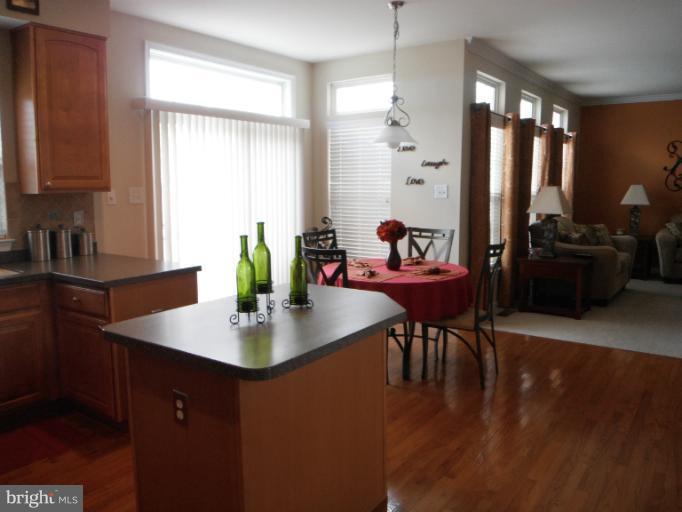 5622 New Forge Road White Marsh, MD 21162 - Photo 5 of 29 a view of a dining room with furniture and wooden floor