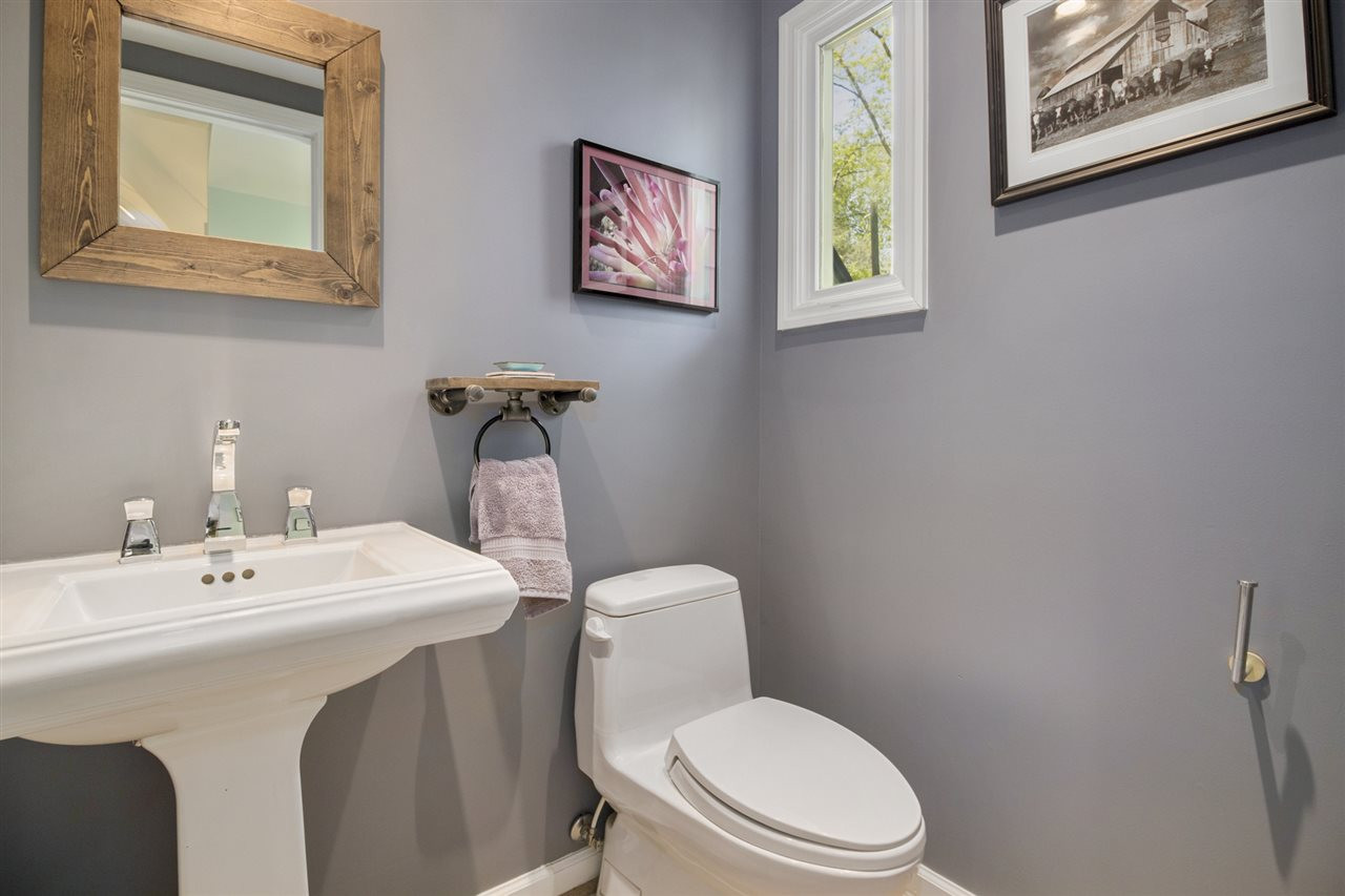 2908 Sandia Drive Raleigh, NC 27607 - Photo 19 of 29 Convenient Main floor powder room is beautiful like all baths in this home. Powder room