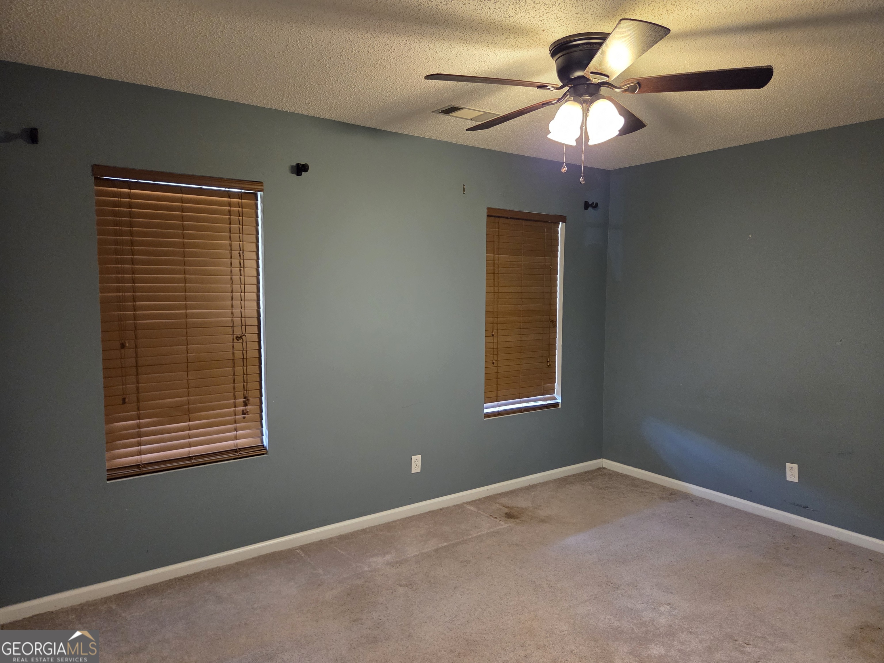 9546 Union Road Metter, GA 30439 - Photo 24 of 45 a view of a livingroom with a chandelier fan and a window