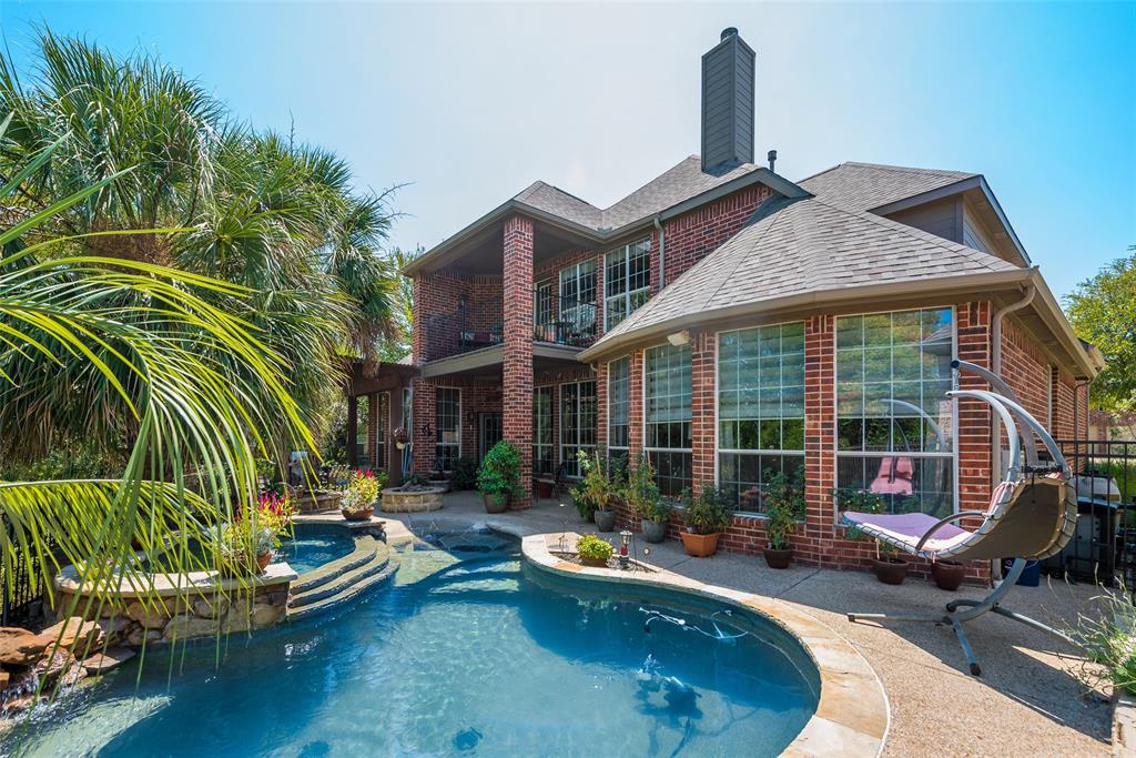 8331 Thatcher Road Lantana, TX 76226 - Photo 1 of 1 a backyard of a house with barbeque oven table and chairs