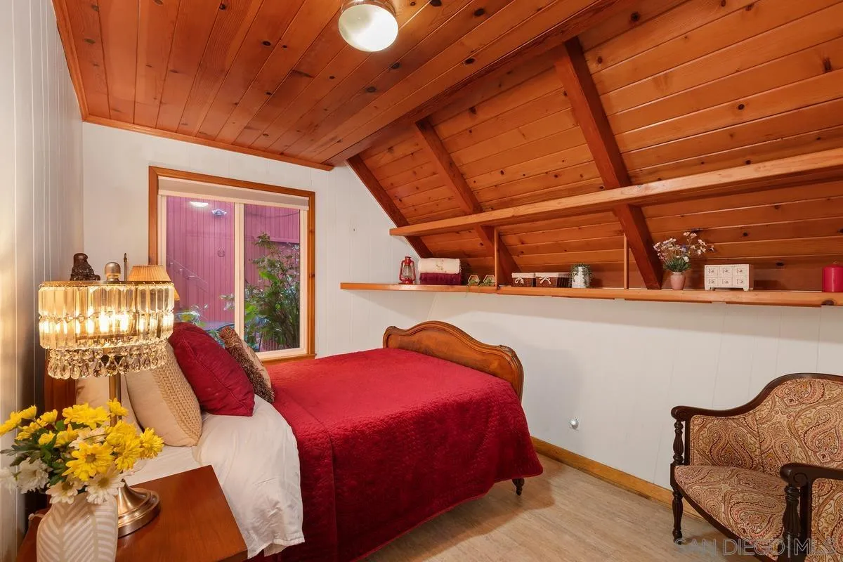 1366 Neptune Avenue Encinitas, CA 92024 - Photo 18 of 48 a bedroom with a bed and window