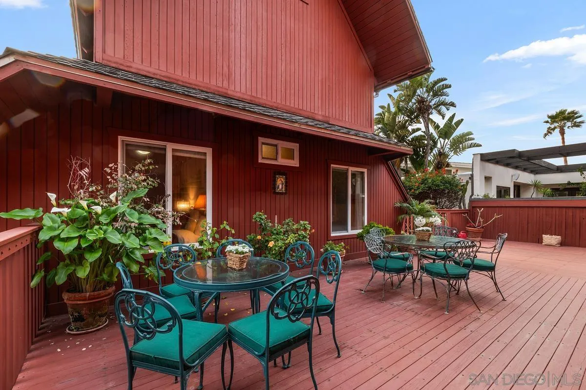 1366 Neptune Avenue Encinitas, CA 92024 - Photo 28 of 48 a backyard of a house with table and chairs