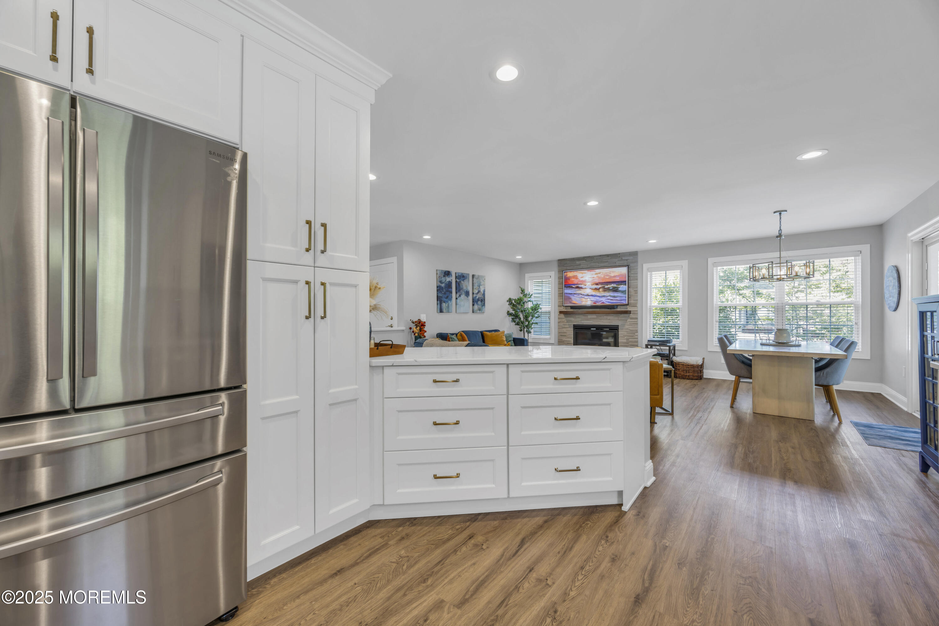 50 Diamond Lane Howell, NJ 07731 - Photo 16 of 49 a kitchen with stainless steel appliances a refrigerator and wooden floor
