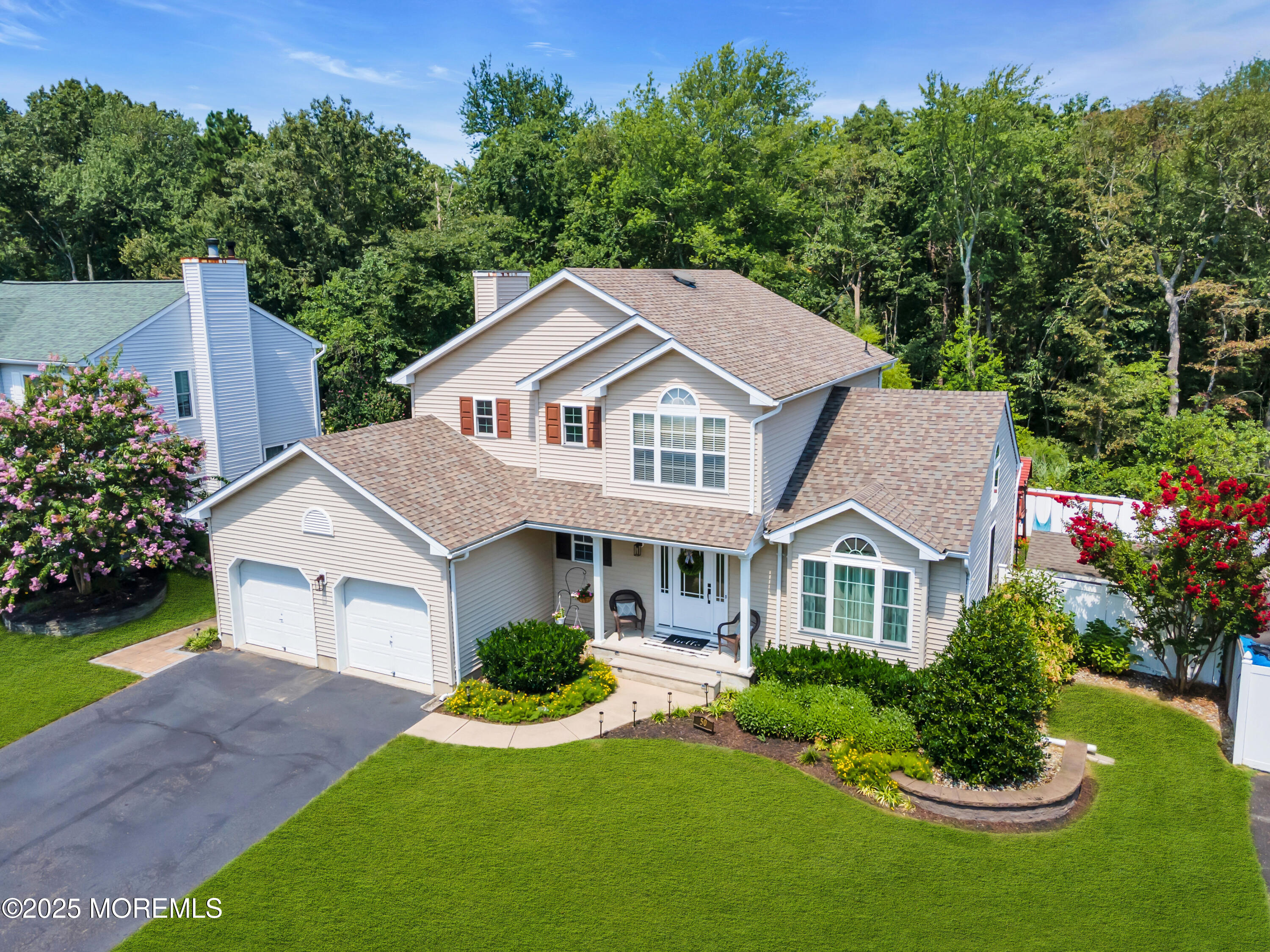 50 Diamond Lane Howell, NJ 07731 - Photo 2 of 49 a front view of a house with a yard and garage