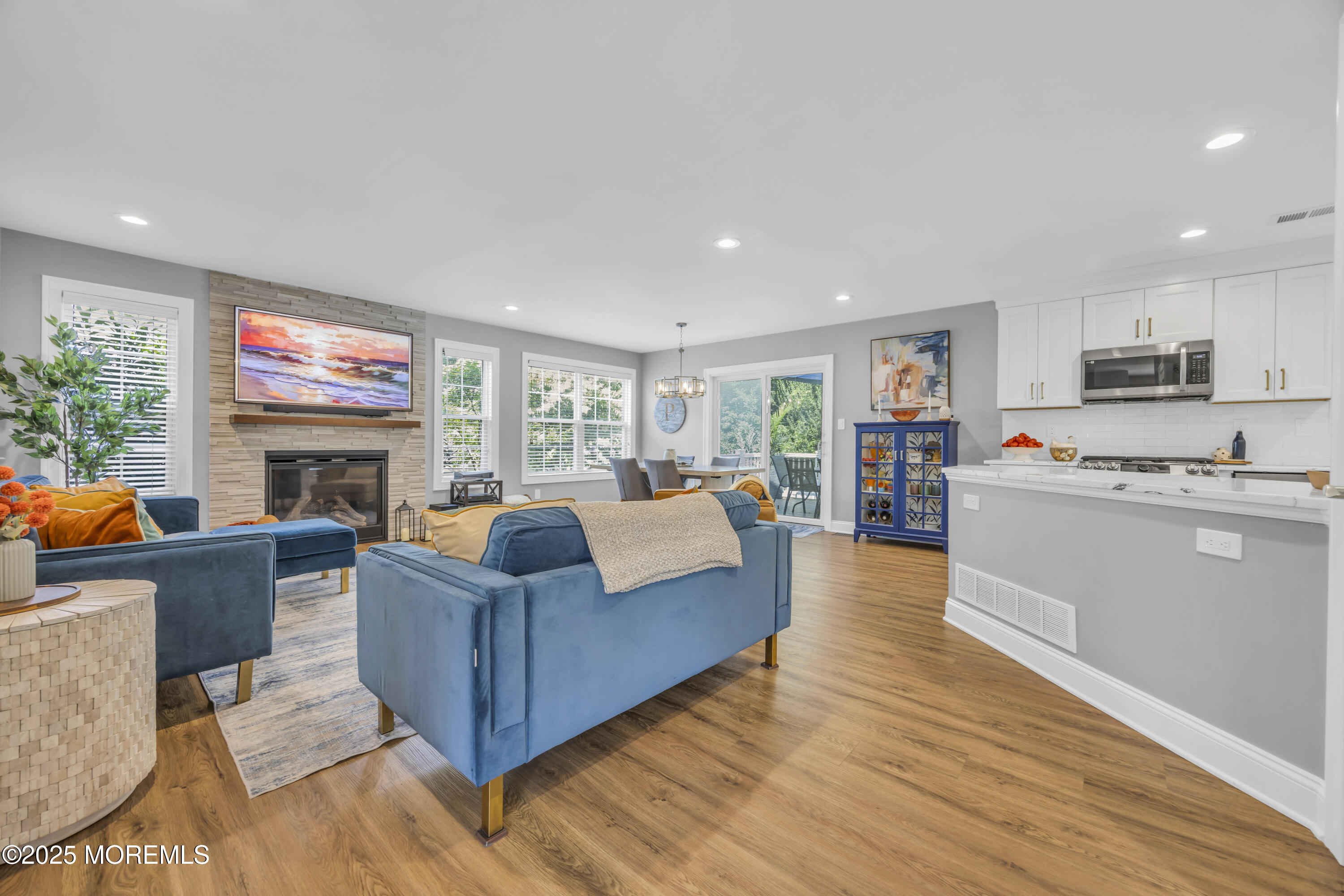 50 Diamond Lane Howell, NJ 07731 - Photo 21 of 49 a living room with furniture and a fireplace