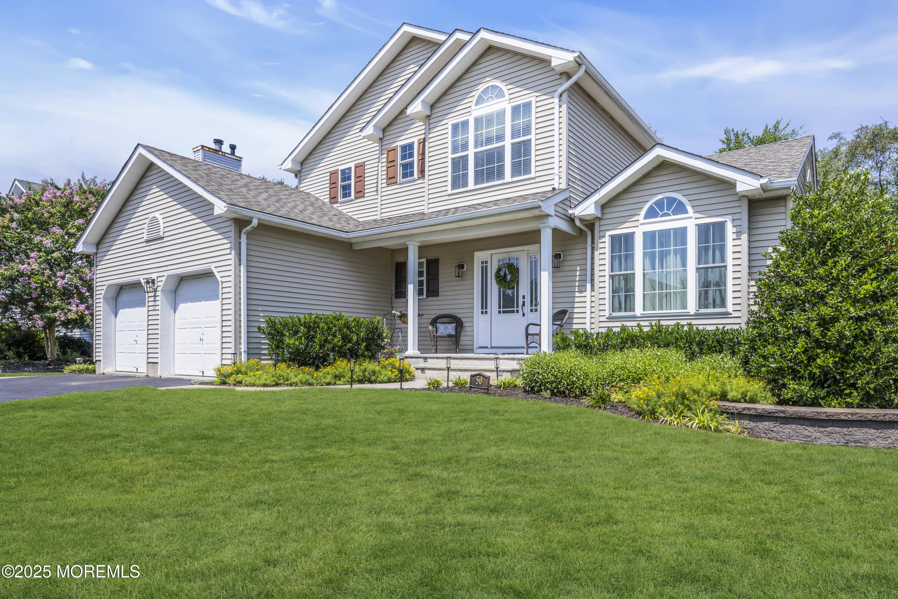 50 Diamond Lane Howell, NJ 07731 - Photo 3 of 49 a front view of a house with a yard and garage