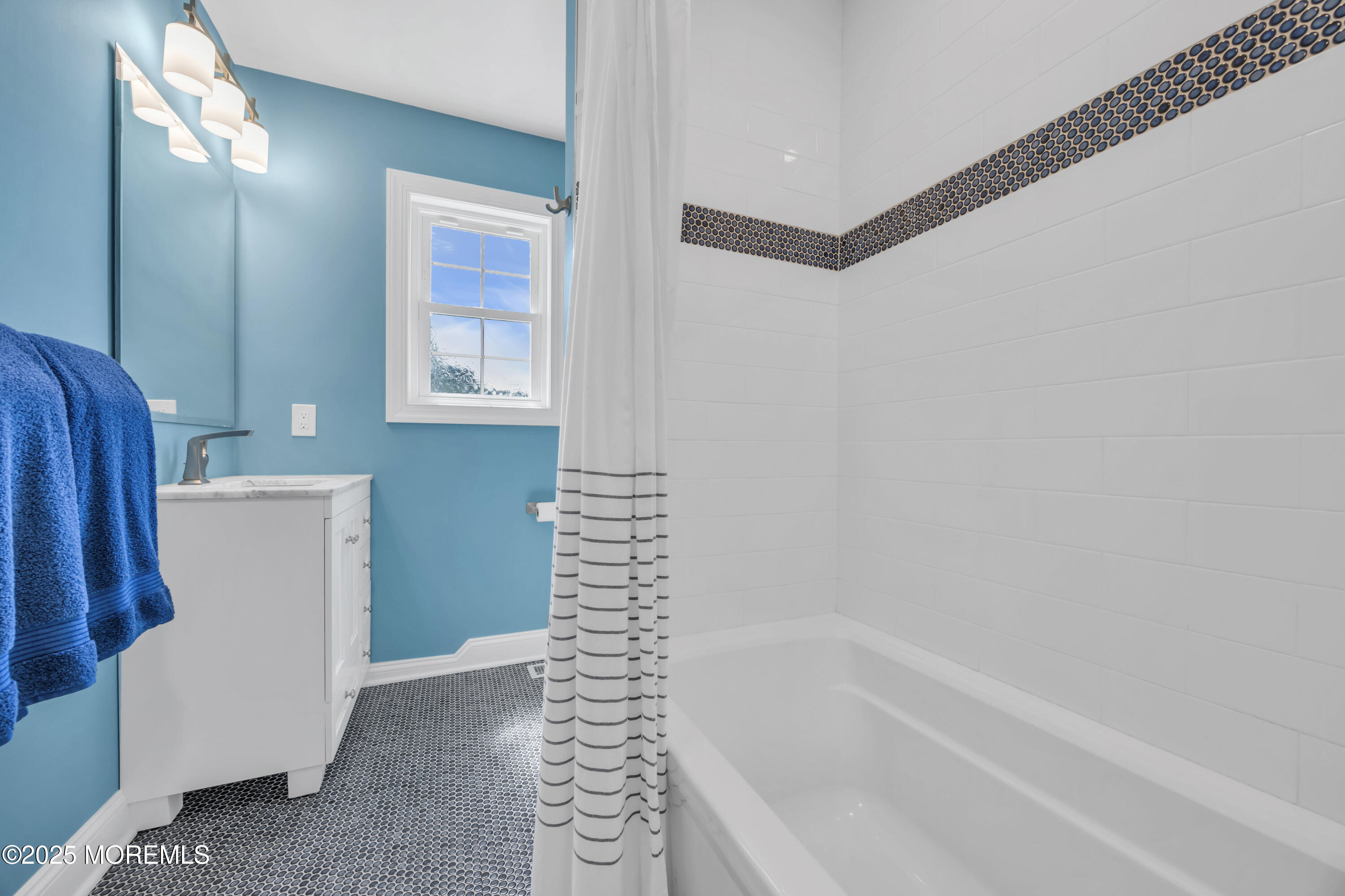 50 Diamond Lane Howell, NJ 07731 - Photo 33 of 49 a bathroom with a bathtub and a window