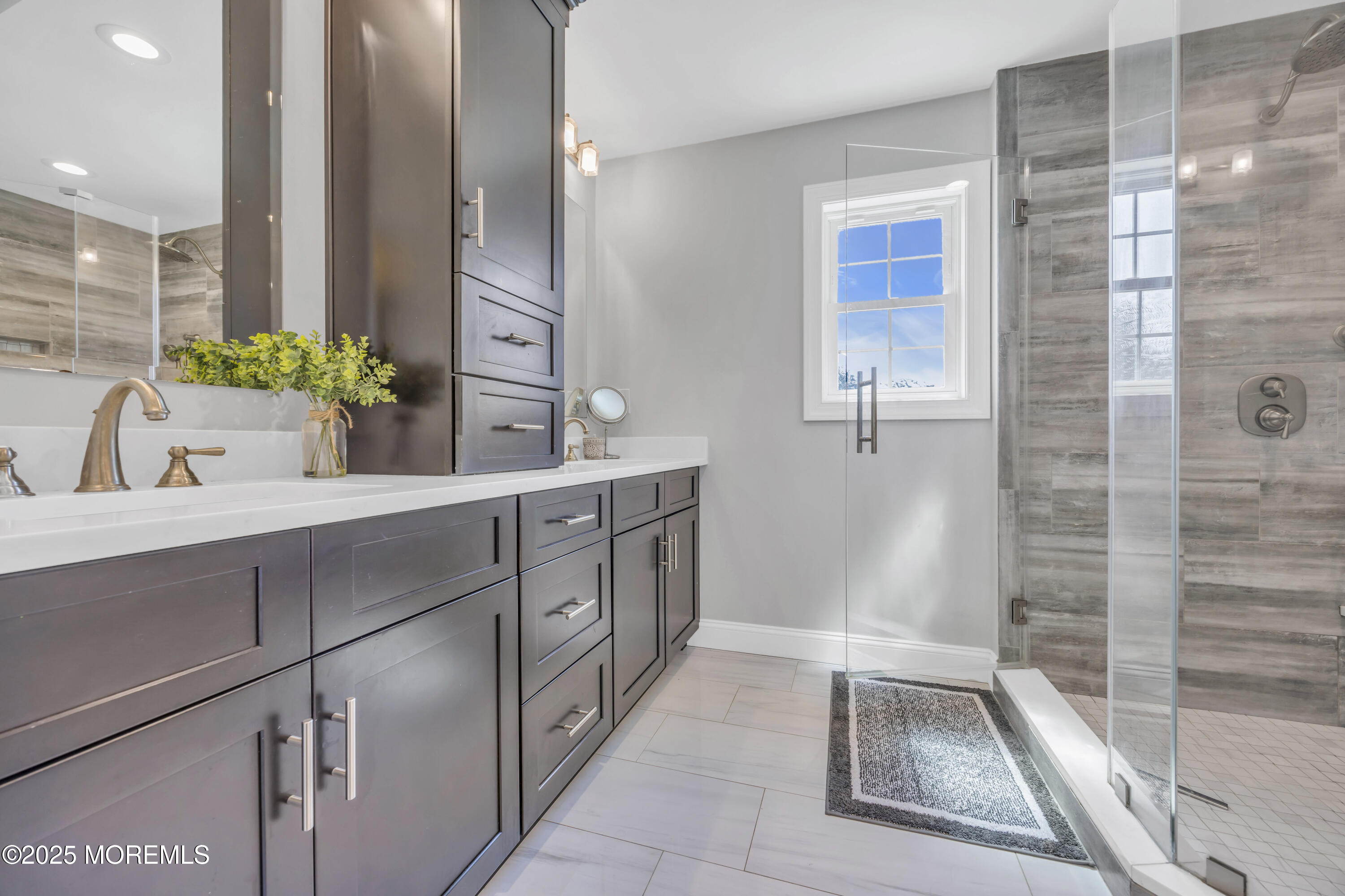 50 Diamond Lane Howell, NJ 07731 - Photo 36 of 49 a bathroom with a tub sink and mirror