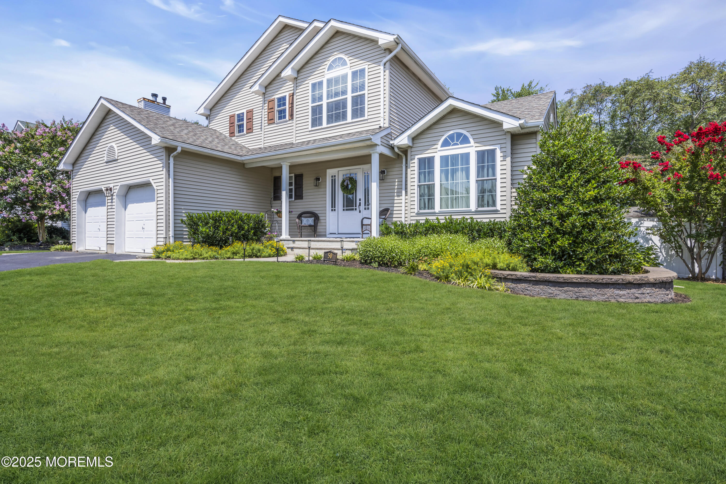 50 Diamond Lane Howell, NJ 07731 - Photo 4 of 49 a front view of a house with a yard and trees