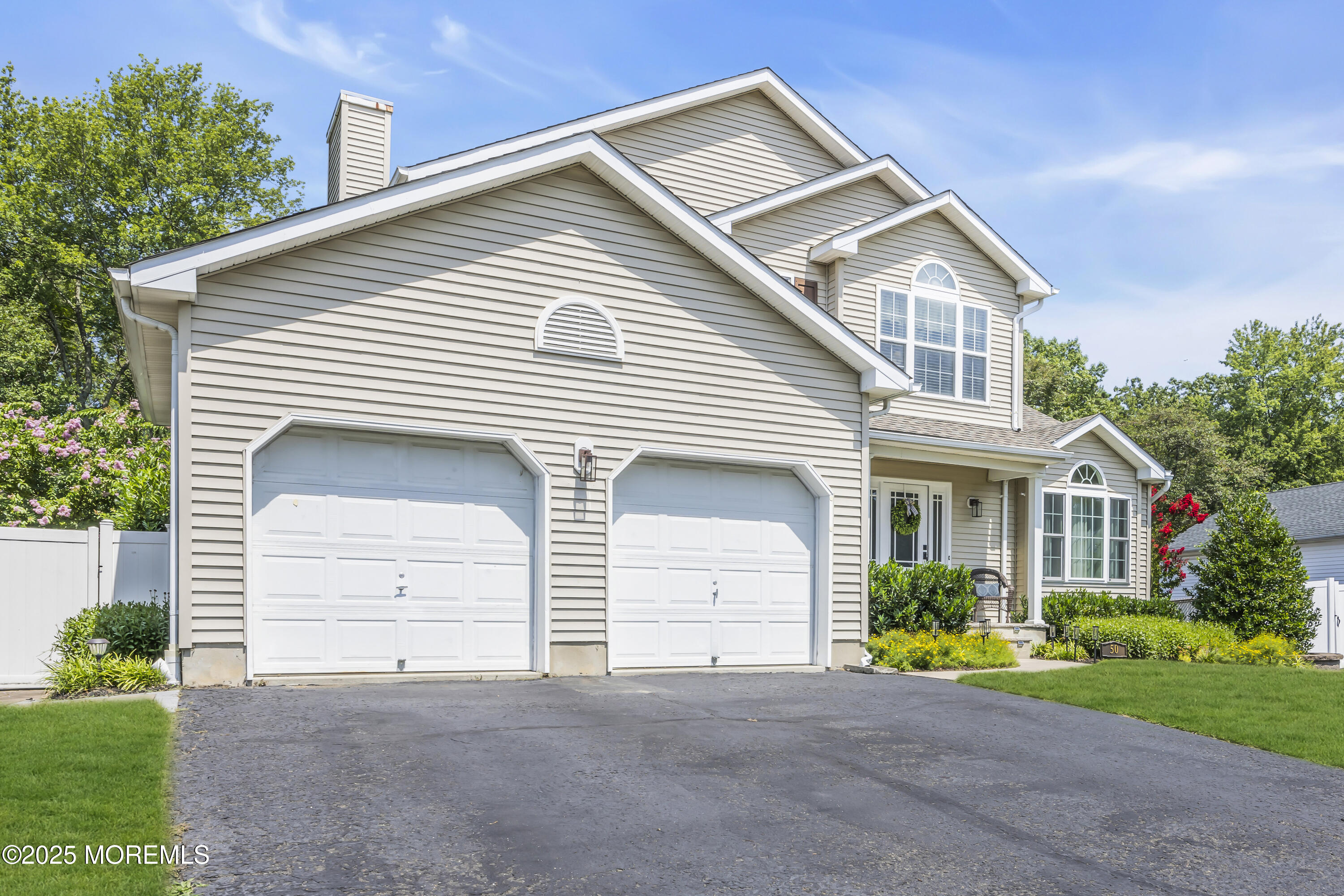 50 Diamond Lane Howell, NJ 07731 - Photo 5 of 49 a front view of a house with a yard and garage