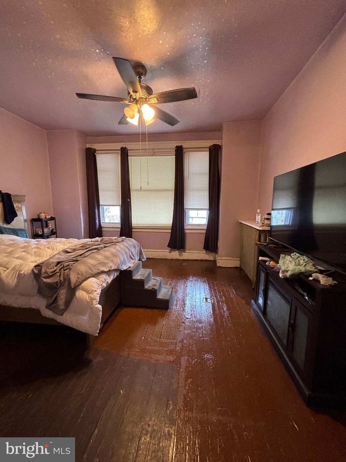 3017 North 26th Street Philadelphia, PA 19132 - Photo 13 of 26 a bedroom with a bed and a flat screen tv