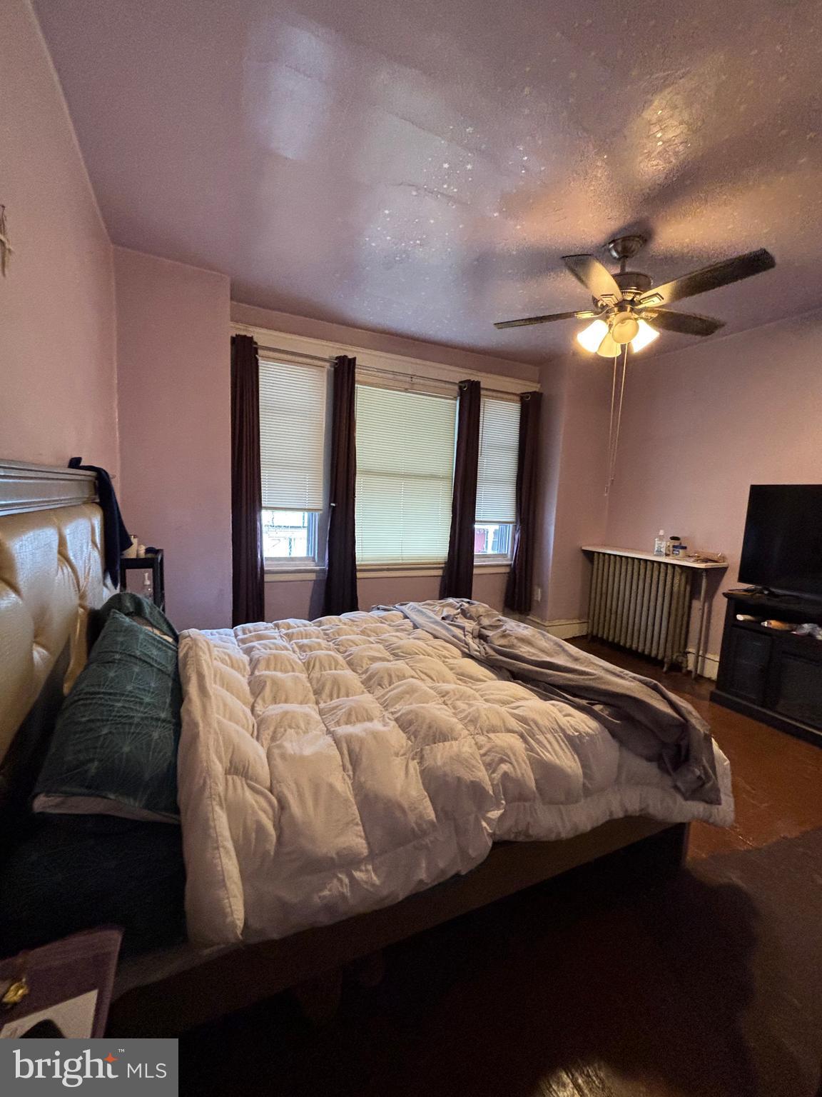 3017 North 26th Street Philadelphia, PA 19132 - Photo 14 of 26 a bedroom with a bed and a chandelier