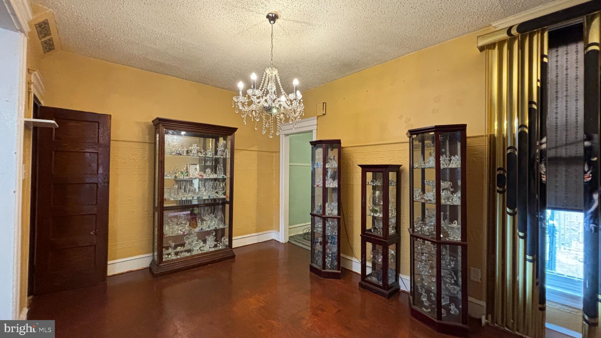 3017 North 26th Street Philadelphia, PA 19132 - Photo 2 of 26 a view of a hallway with wooden shelves