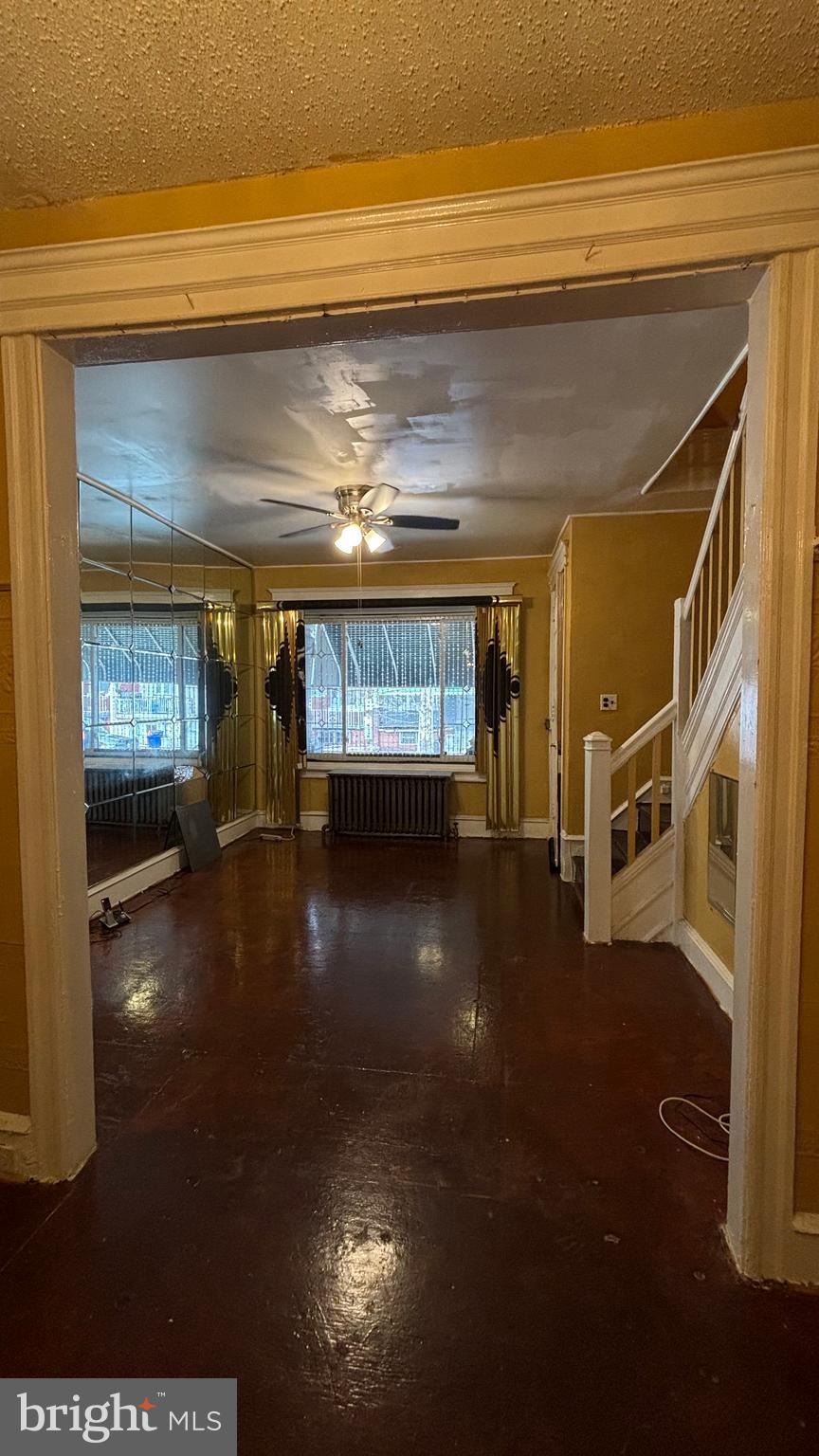 3017 North 26th Street Philadelphia, PA 19132 - Photo 5 of 26 a view of a livingroom with furniture fire place and an entryway