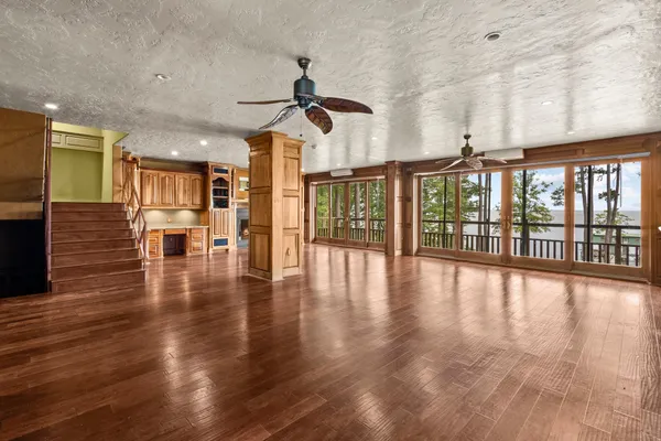 a view of an entryway with wooden floor
