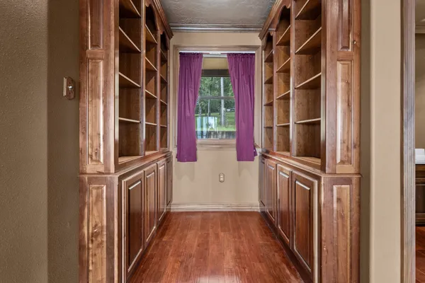 a view of front door and wooden floor