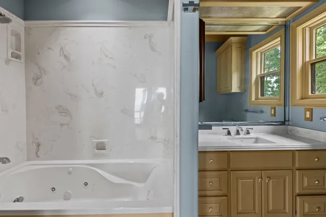 a bathroom with a sink and a bathtub