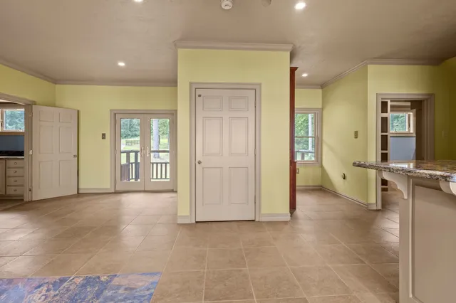 a view of a livingroom with a ceiling fan and window