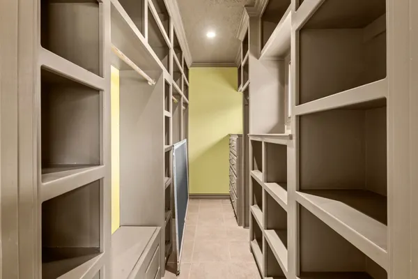 a bathroom with a tub a sink and a large mirror