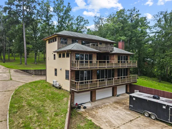 aerial view of a house with a yard