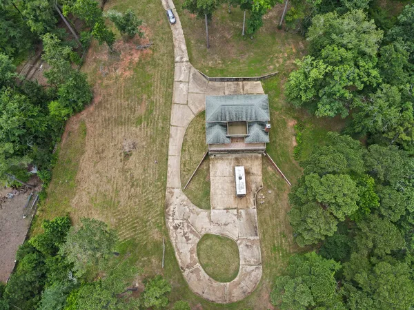 a view of a swimming pool with a yard