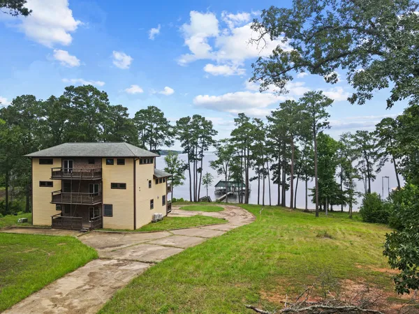 a view of a house with a big yard